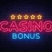 Casino Bonus Neon Text Vector. Bonus neon sign, design template, modern trend design, casino neon signboard, night bright advertising, light banner, light art. Vector illustration.
